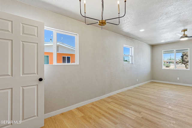 5112 Sun Valley Dr, El Paso, TX 79924 - unfurnished room featuring wood finished floors, a textured ceiling, and a ceiling fan
