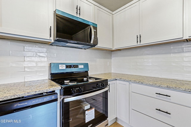 5112 Sun Valley Dr, El Paso, TX 79924 - kitchen with appliances with stainless steel finishes, tasteful backsplash, light stone countertops, and white cabinets