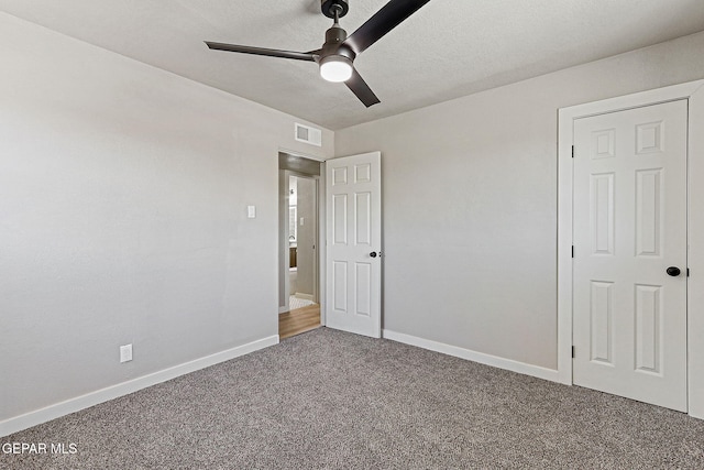 5112 Sun Valley Dr, El Paso, TX 79924 - unfurnished bedroom featuring carpet flooring, a ceiling fan, and a textured ceiling