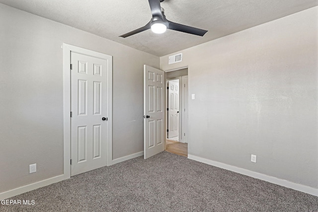 5112 Sun Valley Dr, El Paso, TX 79924 - unfurnished bedroom featuring carpet floors, ceiling fan, and a textured ceiling