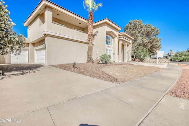 6570 Eagle Ridge Dr, El Paso, TX 79912 - view of front of property with stucco siding, concrete driveway, a balcony, and a garage