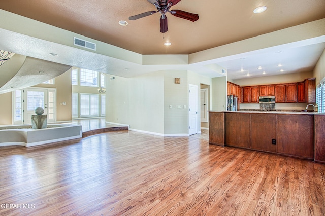 6570 Eagle Ridge Dr, El Paso, TX 79912 - unfurnished living room with light wood-style flooring, ceiling fan, and recessed lighting