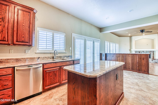 6570 Eagle Ridge Dr, El Paso, TX 79912 - kitchen featuring stainless steel dishwasher, healthy amount of natural light, a kitchen island, and a ceiling fan