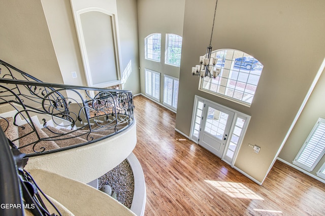 6570 Eagle Ridge Dr, El Paso, TX 79912 - foyer entrance with a towering ceiling, a chandelier, and wood finished floors