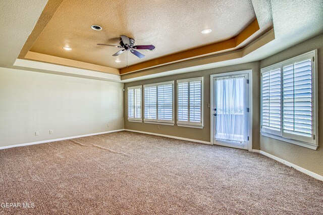 6570 Eagle Ridge Dr, El Paso, TX 79912 - carpeted spare room with a raised ceiling, a textured ceiling, ceiling fan, and recessed lighting