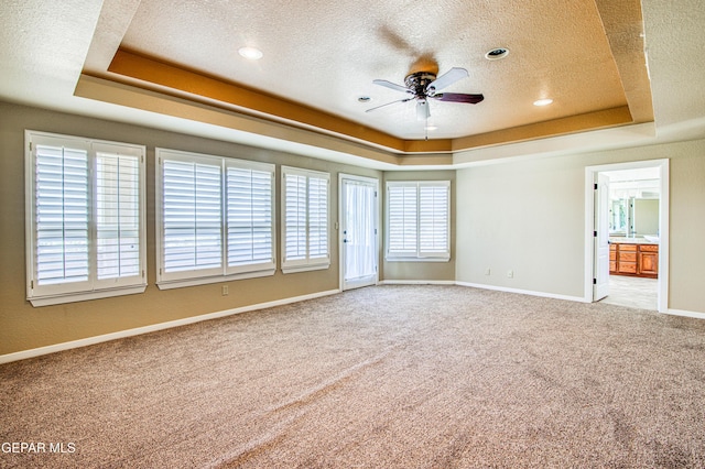 6570 Eagle Ridge Dr, El Paso, TX 79912 - spare room featuring a raised ceiling, ceiling fan, a textured ceiling, carpet, and recessed lighting