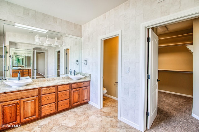 6570 Eagle Ridge Dr, El Paso, TX 79912 - bathroom with double vanity and a spacious closet