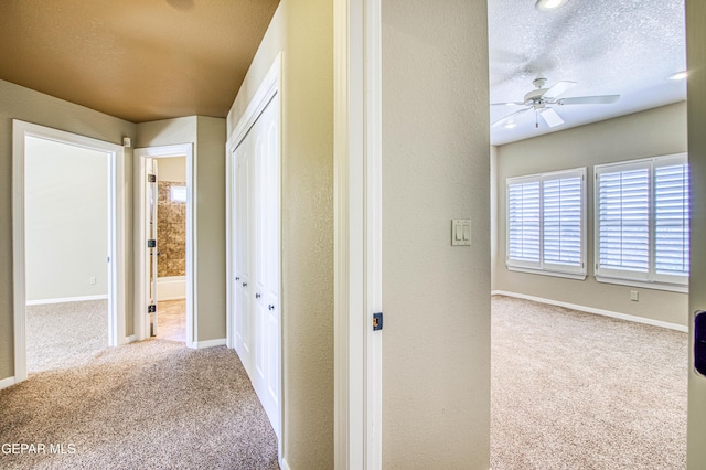 6570 Eagle Ridge Dr, El Paso, TX 79912 - corridor featuring carpet and a textured ceiling