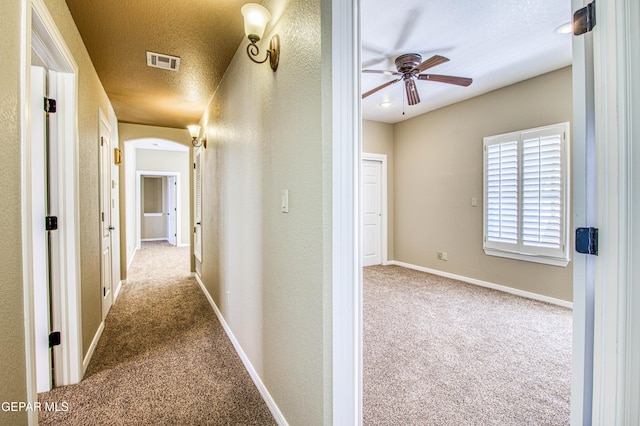6570 Eagle Ridge Dr, El Paso, TX 79912 - hall with carpet, a textured wall, and a textured ceiling