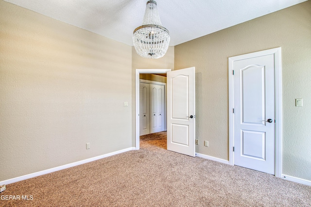 6570 Eagle Ridge Dr, El Paso, TX 79912 - unfurnished bedroom with a chandelier and carpet