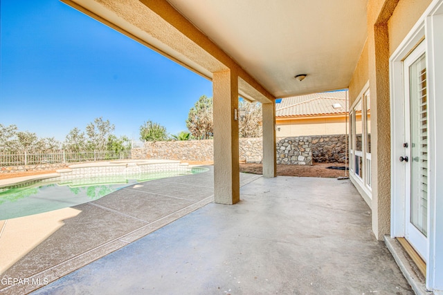 6570 Eagle Ridge Dr, El Paso, TX 79912 - fenced backyard with a patio area and a pool with connected hot tub