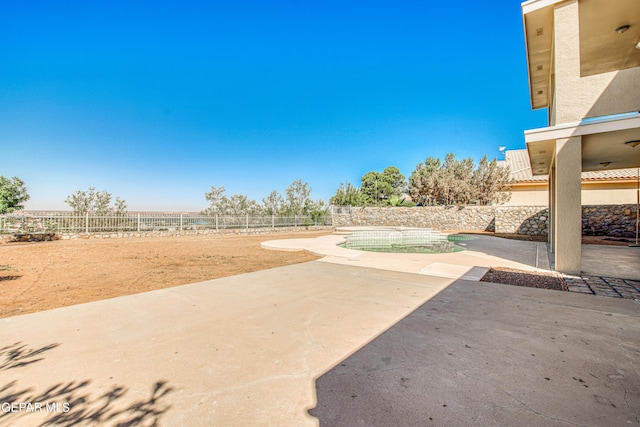 6570 Eagle Ridge Dr, El Paso, TX 79912 - fenced backyard with a patio