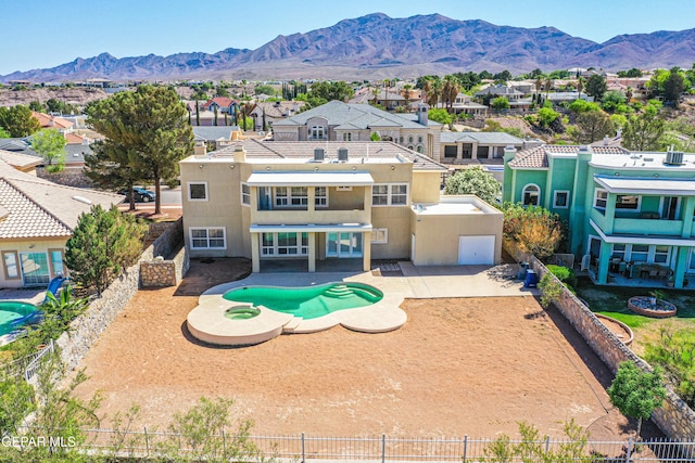 6570 Eagle Ridge Dr, El Paso, TX 79912 - back of house with a residential view, a fenced backyard, and stucco siding