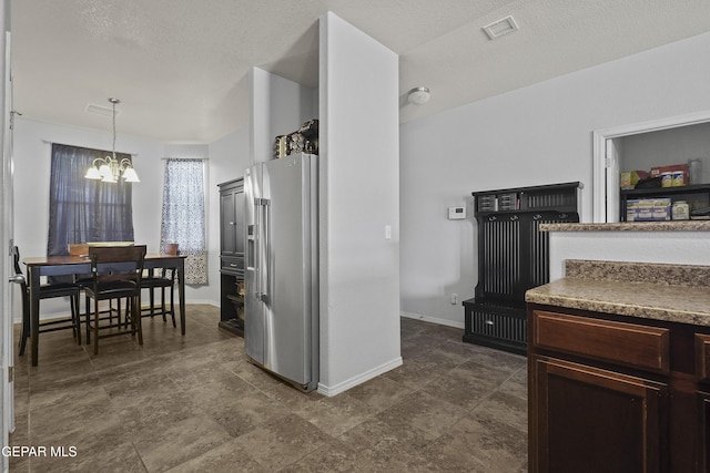 14477 Jacinto Ramos Ave, El Paso, TX 79938 - kitchen featuring high quality fridge, a chandelier, and hanging light fixtures