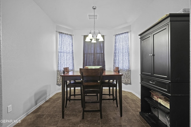 14477 Jacinto Ramos Ave, El Paso, TX 79938 - dining area featuring a chandelier and baseboards
