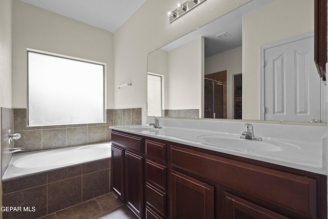 14477 Jacinto Ramos Ave, El Paso, TX 79938 - bathroom featuring double vanity, a stall shower, a garden tub, and tile patterned floors