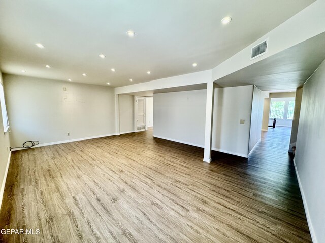 536 Satellite Dr, El Paso, TX 79912 - unfurnished living room featuring wood finished floors and recessed lighting