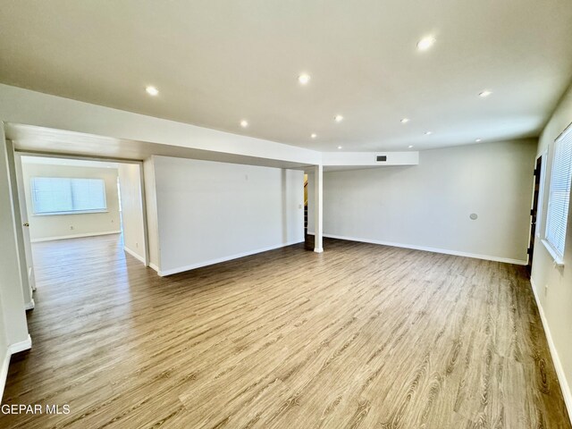 536 Satellite Dr, El Paso, TX 79912 - spare room featuring wood finished floors and recessed lighting