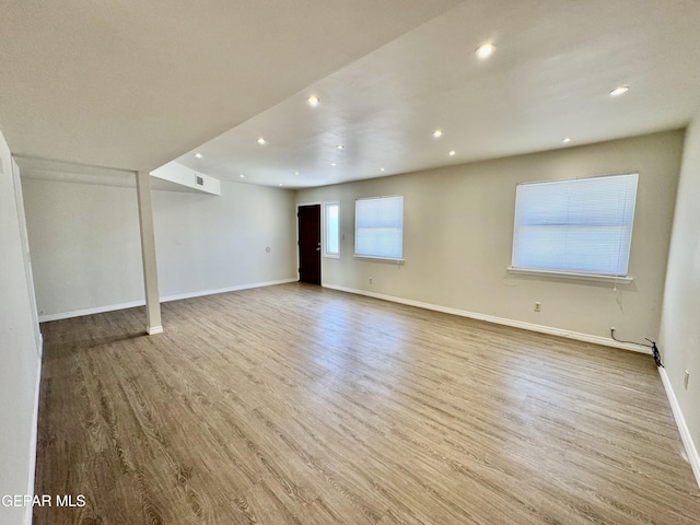 536 Satellite Dr, El Paso, TX 79912 - unfurnished living room featuring recessed lighting and wood finished floors