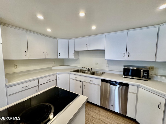 536 Satellite Dr, El Paso, TX 79912 - kitchen featuring appliances with stainless steel finishes, white cabinetry, light wood-type flooring, light countertops, and recessed lighting