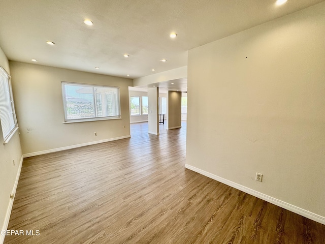 536 Satellite Dr, El Paso, TX 79912 - empty room featuring wood finished floors and recessed lighting
