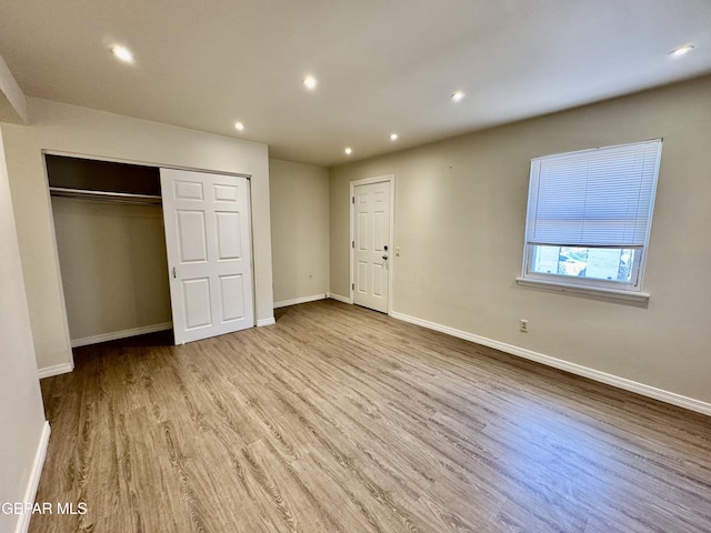 536 Satellite Dr, El Paso, TX 79912 - unfurnished bedroom featuring wood finished floors, recessed lighting, and a closet