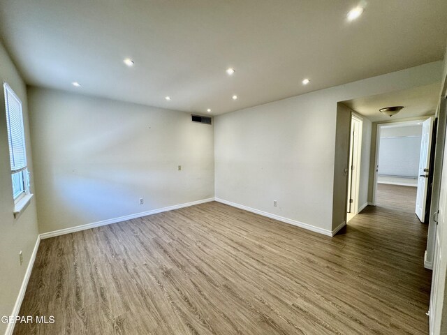 536 Satellite Dr, El Paso, TX 79912 - spare room featuring wood finished floors and recessed lighting