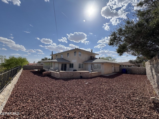 536 Satellite Dr, El Paso, TX 79912 - back of property with a fenced backyard and a patio area