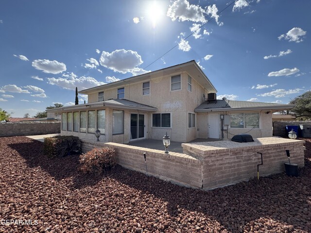 536 Satellite Dr, El Paso, TX 79912 - back of property with a patio and a sunroom