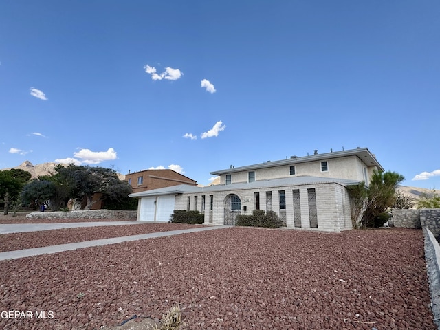 536 Satellite Dr, El Paso, TX 79912 - view of front of home featuring driveway and an attached garage