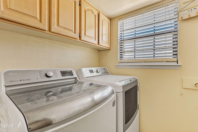 9769 Galilee Dr, El Paso, TX 79927 - washroom with cabinet space, washer and clothes dryer, and a textured ceiling