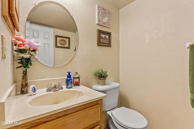 9769 Galilee Dr, El Paso, TX 79927 - half bathroom with vanity and a textured wall