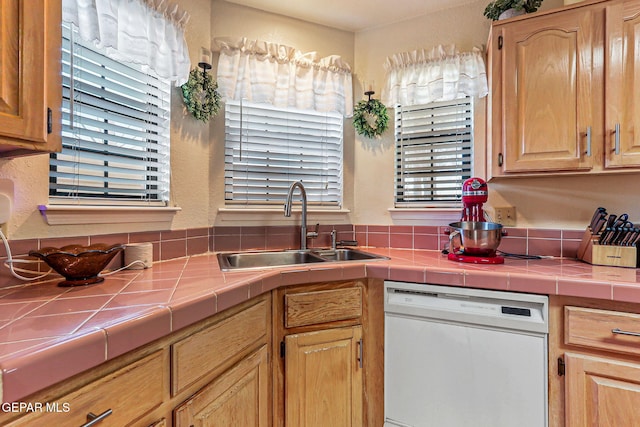 9769 Galilee Dr, El Paso, TX 79927 - kitchen featuring dishwasher, tile counters, and light brown cabinetry