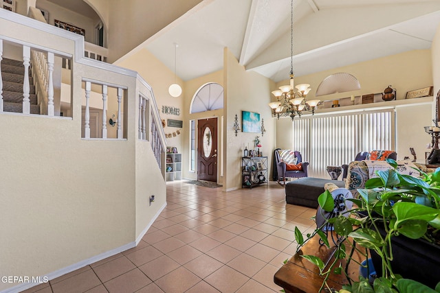 9769 Galilee Dr, El Paso, TX 79927 - tiled entrance foyer with high vaulted ceiling, a chandelier, and stairs
