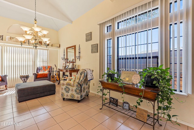 9769 Galilee Dr, El Paso, TX 79927 - tiled living room featuring a chandelier and high vaulted ceiling