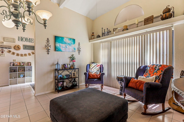 9769 Galilee Dr, El Paso, TX 79927 - living area with light tile patterned floors, a chandelier, and high vaulted ceiling