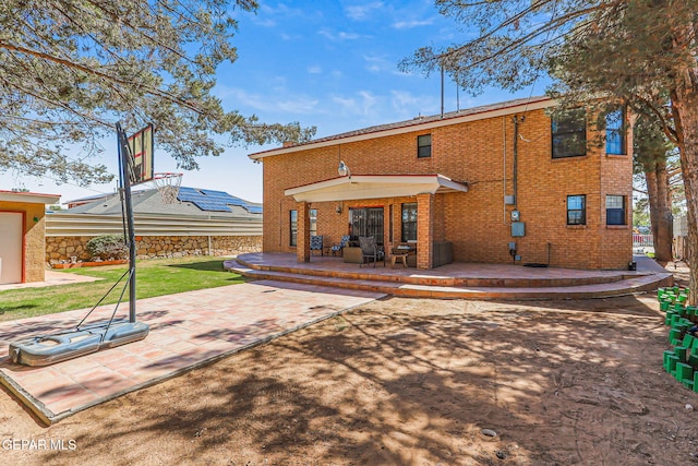 9769 Galilee Dr, El Paso, TX 79927 - rear view of property with brick siding, a patio area, and a deck