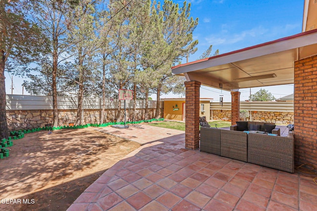 9769 Galilee Dr, El Paso, TX 79927 - fenced backyard with an outdoor hangout area and a patio