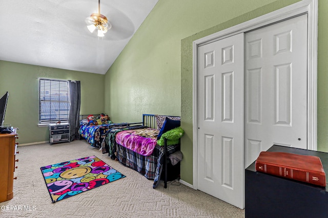 9769 Galilee Dr, El Paso, TX 79927 - bedroom featuring carpet, vaulted ceiling, ceiling fan, and a closet