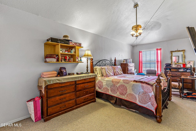 9769 Galilee Dr, El Paso, TX 79927 - bedroom featuring light colored carpet, a textured ceiling, and lofted ceiling