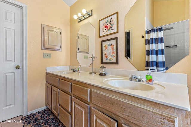 9769 Galilee Dr, El Paso, TX 79927 - full bath with double vanity and curtained shower