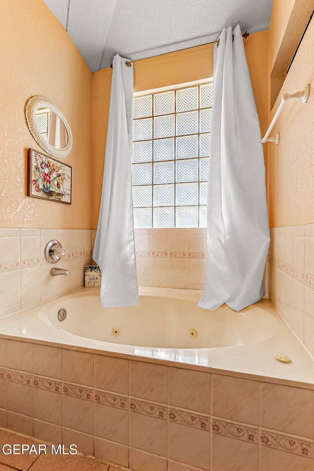 9769 Galilee Dr, El Paso, TX 79927 - bathroom with plenty of natural light and a whirlpool tub