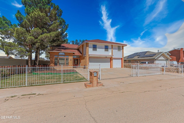 9769 Galilee Dr, El Paso, TX 79927 - view of front of property with a garage, driveway, and stucco siding