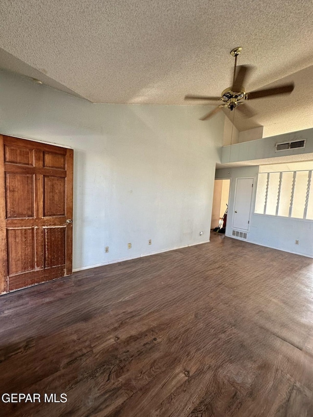 11049 Middledale St, El Paso, TX 79934 - unfurnished living room featuring a textured ceiling, lofted ceiling, a ceiling fan, and dark wood-type flooring