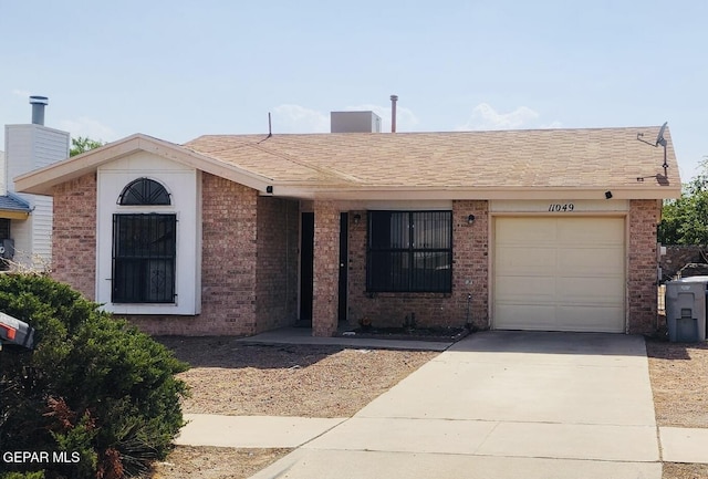 11049 Middledale St, El Paso, TX 79934 - single story home featuring driveway, brick siding, an attached garage, and a chimney