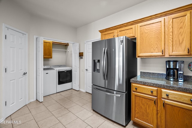 11202 Redstone Peak Place, El Paso, TX 79934 - kitchen featuring stainless steel refrigerator with ice dispenser, tile countertops, washing machine and dryer, light tile patterned flooring, and brown cabinets