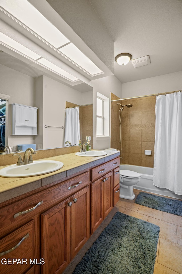 11202 Redstone Peak Place, El Paso, TX 79934 - full bath with double vanity, shower / tub combo, and tile patterned flooring
