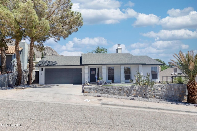 612 Firedale Ln, El Paso, TX 79912 - single story home with an attached garage, driveway, and roof with shingles