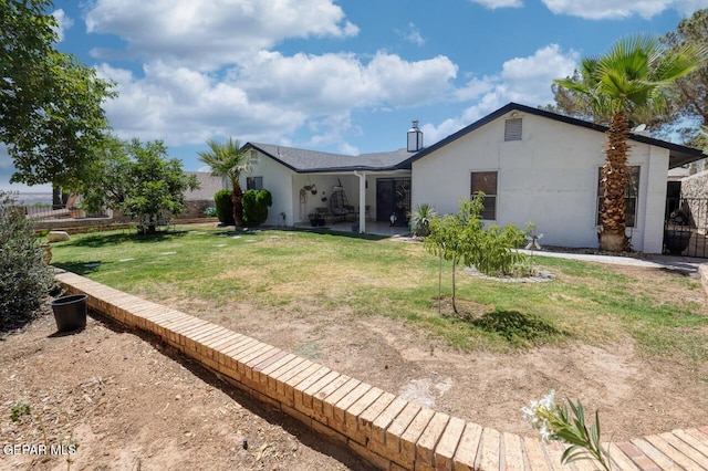 612 Firedale Ln, El Paso, TX 79912 - back of house featuring a patio, a chimney, and stucco siding