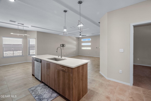 7722 Enchanted Ridge Dr, El Paso, TX 79911 - kitchen featuring dishwasher, light tile patterned flooring, decorative light fixtures, ceiling fan, and an island with sink